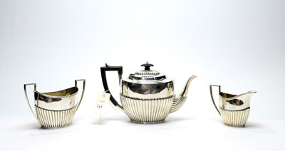 Lot 101 - A three-piece silver tea service, by James Deakin & Sons