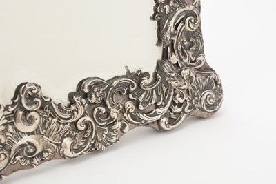 Lot 90 - An Edwardian silver mounted dressing table mirror