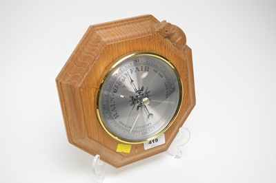 Lot 419 - A Robert ‘Mouseman’ Thompson carved oak wall barometer.
