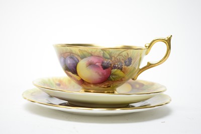 Lot 399 - A harlequin set of five Aynsley fruit decorated tea trios