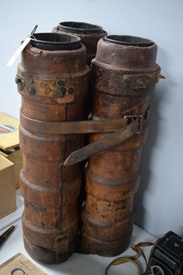 Lot 542 - Three leather bound artillery shell carrier.