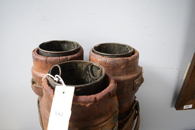 Lot 542 - Three leather bound artillery shell carrier.
