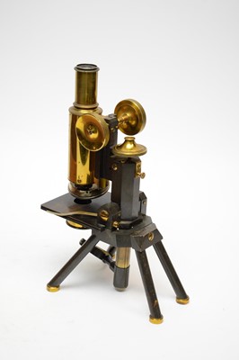 Lot 322 - A brass lacquered microscope, by J. Swift & Son, London, in stained wood carry case.