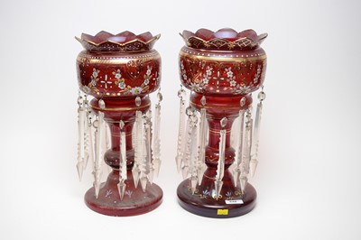 Lot 448 - A pair of Victorian cranberry glass lustres.