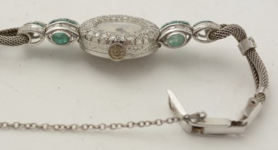 Lot 606 - An Art Deco emerald and diamond cocktail watch