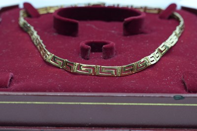 Lot 121 - A 14ct yellow gold necklace, of Greek key design