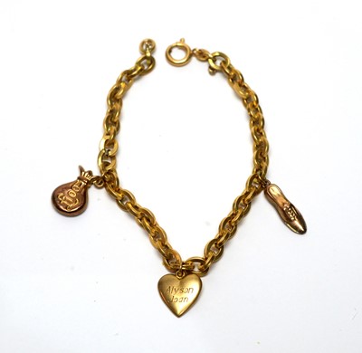 Lot 148 - A yellow gold charm bracelet