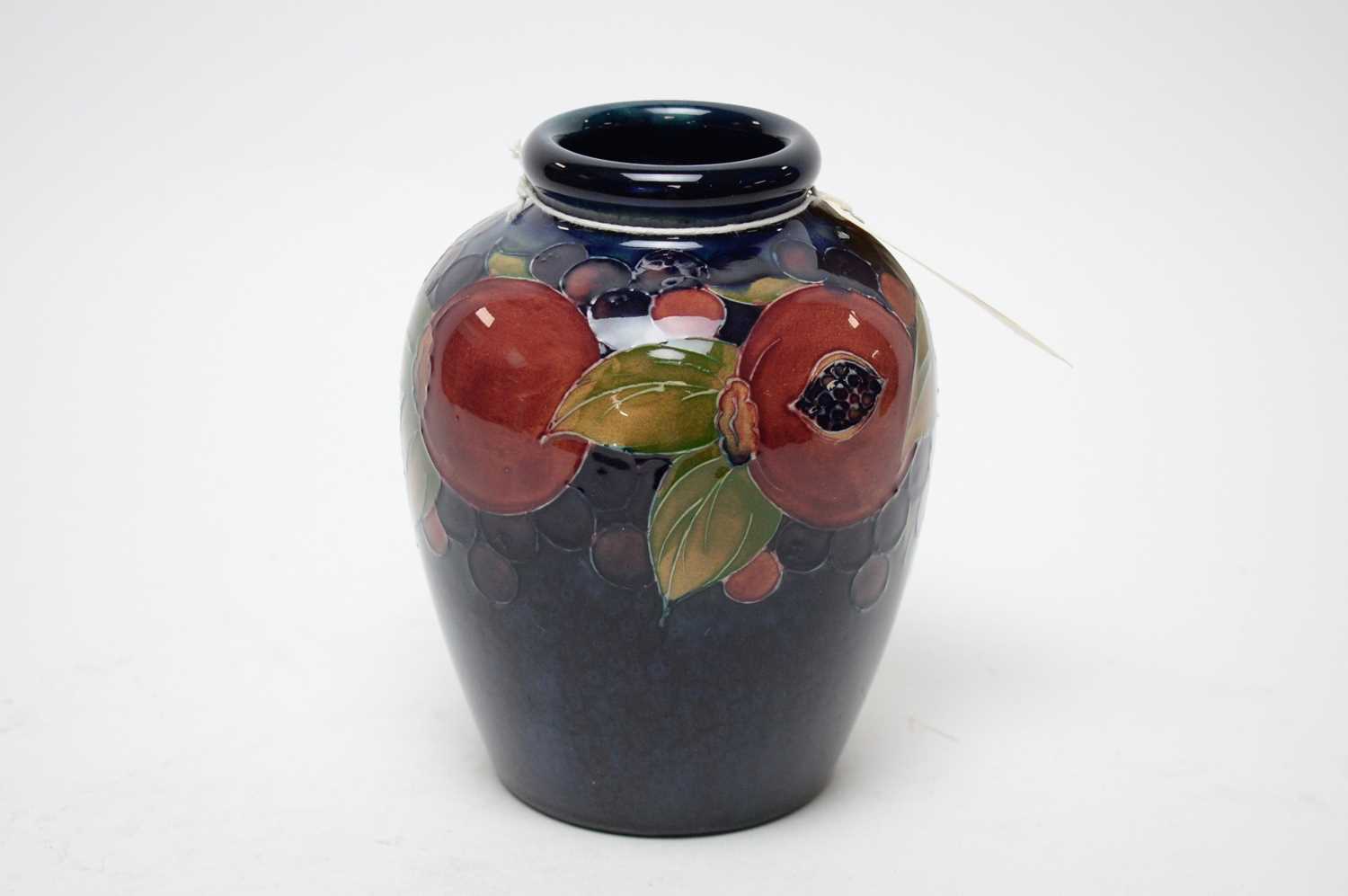 Lot 386 - A Moorcroft ‘Pomegranate’ pattern vase.