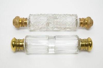 Lot 145 - Three Victorian cut glass double-ended scent bottles