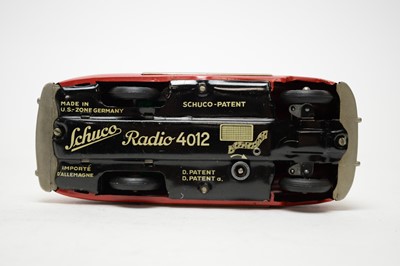 Lot 405 - A Schuco Radio 4012, formed as a musical red tin plate clockwork car.