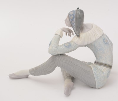 Lot 785 - A Lladro figure, a Lladro vase and a Nao Harlequin figure