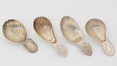 Lot 175 - Four various George III silver “stamped” caddy spoons