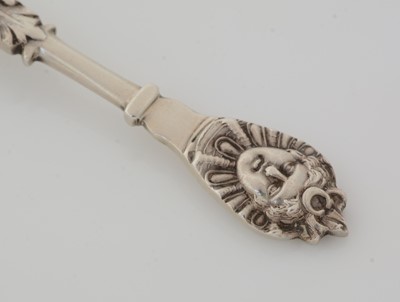 Lot 177 - Two Victorian silver caddy spoons and another with figural terminal
