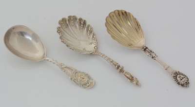 Lot 177 - Two Victorian silver caddy spoons and another with figural terminal