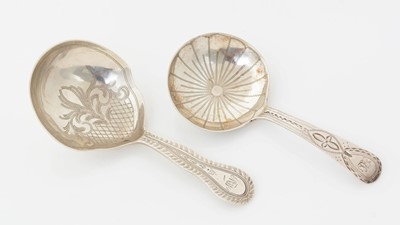 Lot 192 - A George III silver provincial caddy spoon and an engraved Victorian silver caddy spoon