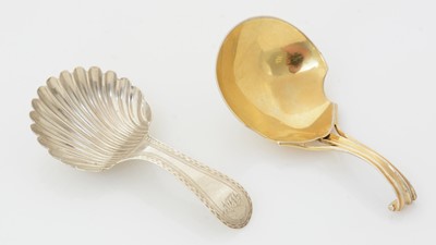 Lot 193 - A George III silver caddy spoon and a silver gilt caddy spoon