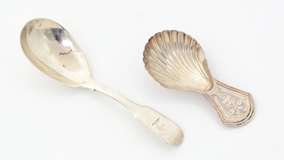 Lot 194 - A Victorian silver provincial fiddle-pattern caddy spoon and a Sheffield-made silver caddy spoon