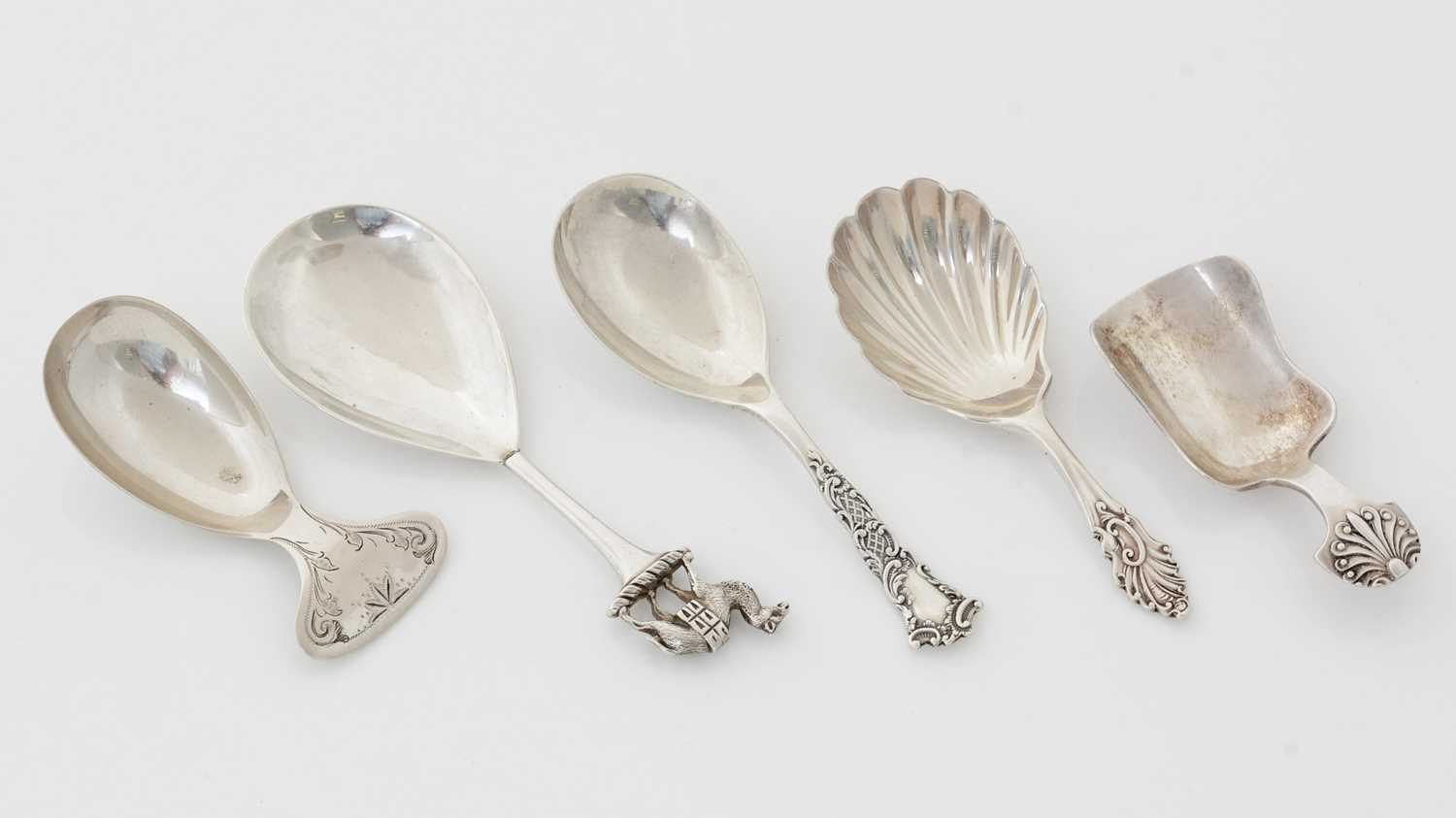 Lot 197 - A late Victorian silver caddy spoon and four other caddy spoons