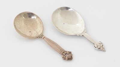 Lot 205 - A George V silver caddy spoon and a Danish silver Cactus pattern caddy spoon