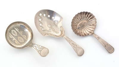 Lot 217 - Three George III silver caddy spoons