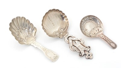 Lot 218 - A Victorian silver caddy spoon and two other Birmingham made silver caddy spoons