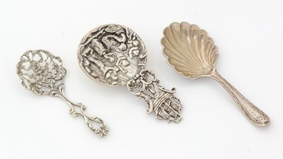Lot 240 - A continental silver-cast caddy spoon, a late 18th Century Dutch silver caddy spoon, and a small silver spoon