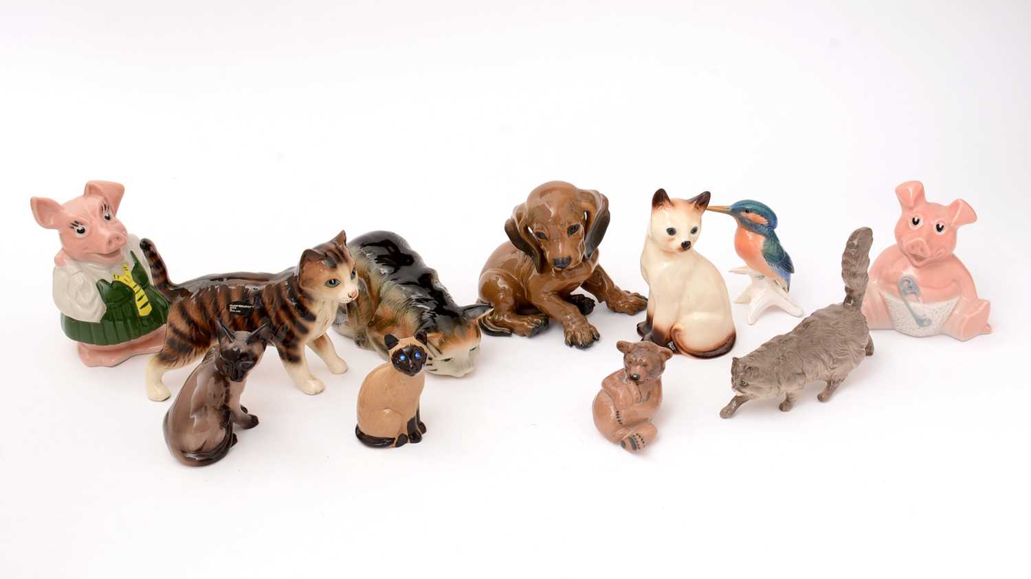 Lot 704 - A selection of animal figures and two Wade pig money banks.