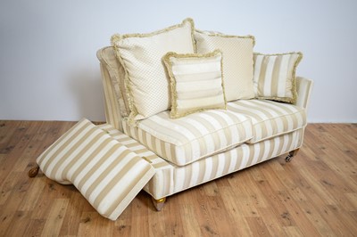 Lot 81 - Gascoigne Designs: A contemporary luxury two-seater drop-arm sofa.