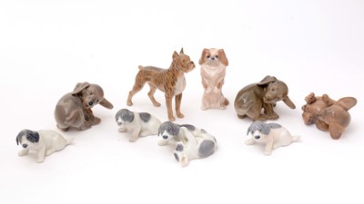 Lot 705 - A selection of Royal Copenhagen dog figurines.