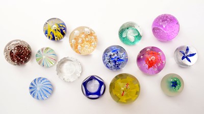 Lot 883 - A collection of 20th Century glass paperweights