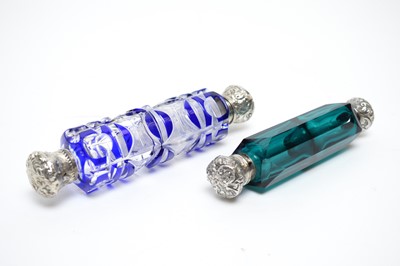Lot 147 - Two 19th Century cut-glass double-ended scent bottles with white metal mounts