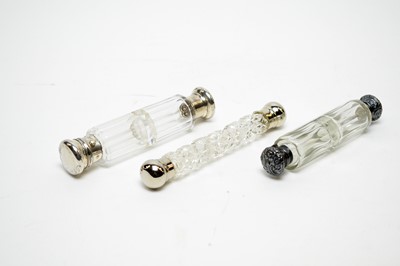 Lot 148 - Three 19th Century cut-glass double-ended scent bottles