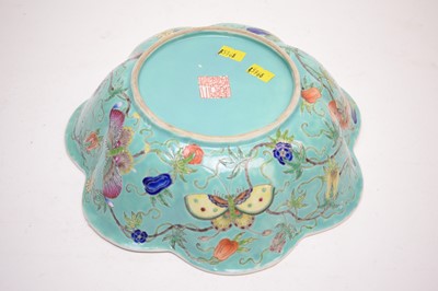 Lot 340 - A Chinese scalloped circular bowl, decorated with butterflies, flowers and foliage.