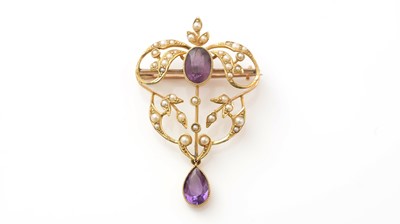 Lot 514 - An Edwardian amethyst and pearl brooch/pendant