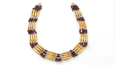 Lot 518 - An Egyptian 18ct yellow gold and garnet necklace