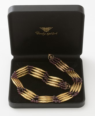Lot 700 - An Egyptian yellow gold and garnet necklace