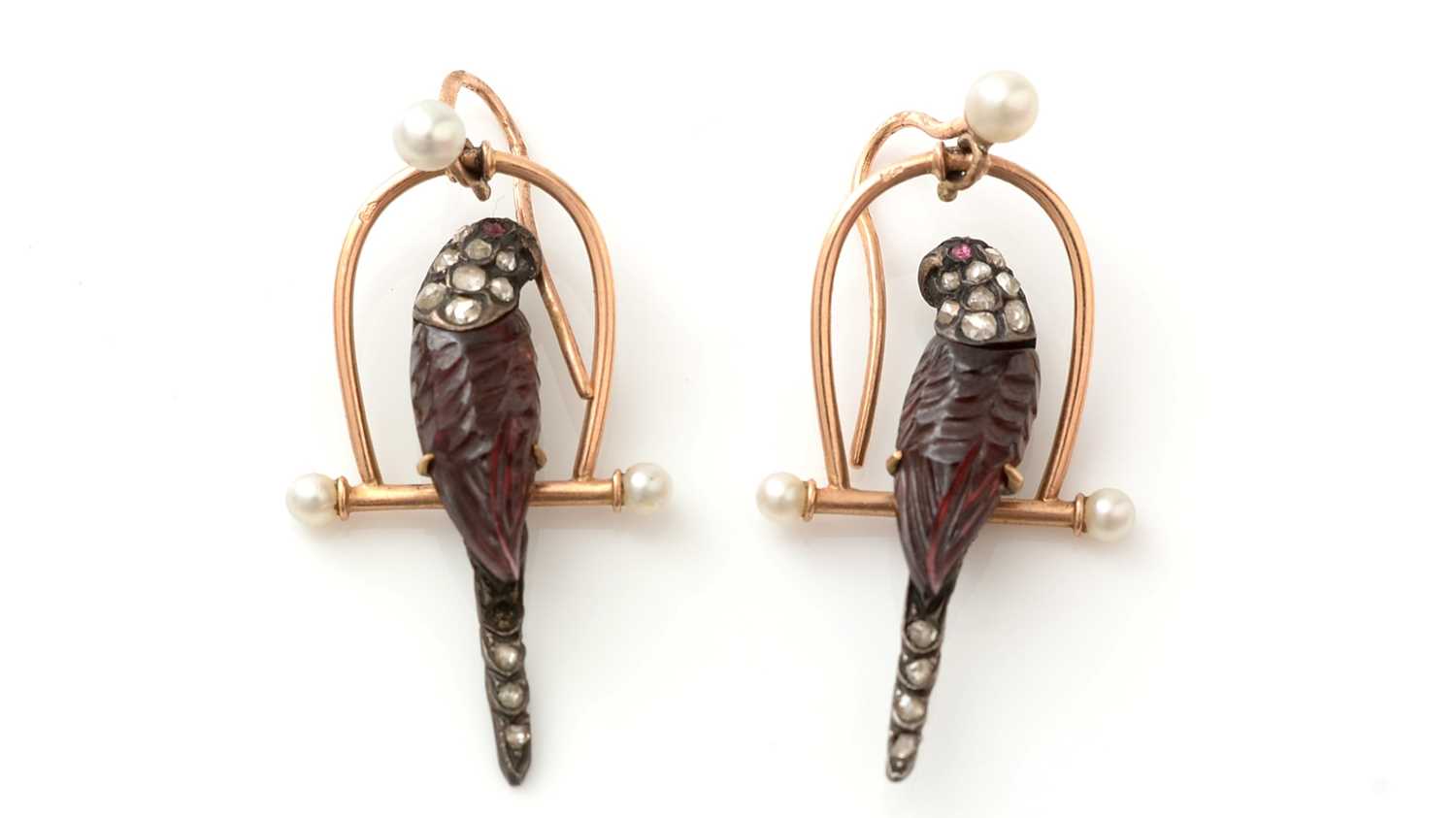 Lot 519 - A fine and unusual pair of Victorian diamond and carved garnet parrot on perch pattern earrings