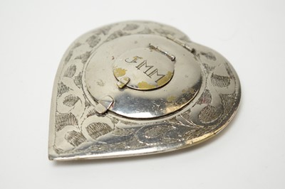 Lot 97 - 1940s Second World War Eastern white metal and base metal compacts