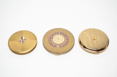 Lot 126 - 1940s and 1950s novelty powder compacts, including "Roulette", and 1951 Festival of Britain