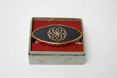 Lot 130 - 1950s Kigu of London musical compacts