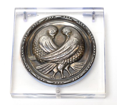 Lot 62 - A late 1930s white metal and lucite powder compact depicting a pair of doves
