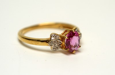 Lot 218 - A pink sapphire and diamond ring