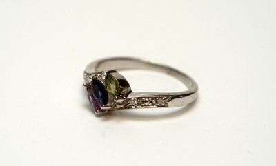 Lot 217 - A blue, pink and green sapphire and diamond ring