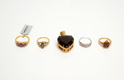 Lot 224 - A smokey quartz heart-shaped pendant, and four gem set rings