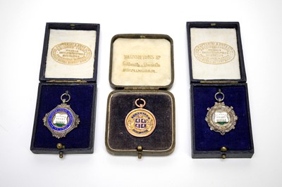 Lot 85 - A 9ct yellow gold fob medal, Junior League Rugby Union Challenge Cup Winners, and two others