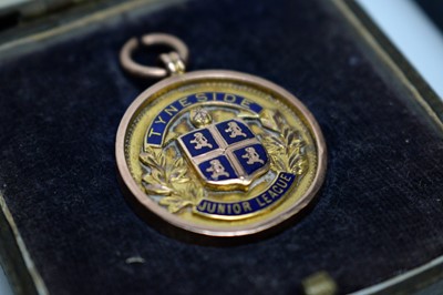Lot 85 - A 9ct yellow gold fob medal, Junior League Rugby Union Challenge Cup Winners, and two others