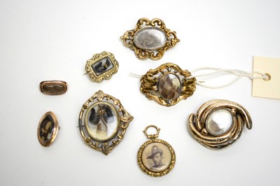 Lot 106 - Seven Victorian mourning brooches, and a picture pendant.