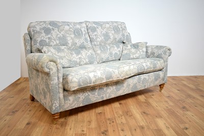 Lot 58 - Duresta two-seater sofa and chair upholstered in pale blue floral woven cotton.