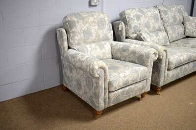 Lot 40 - Duresta two-seater sofa and chair upholstered in pale blue floral woven cotton.