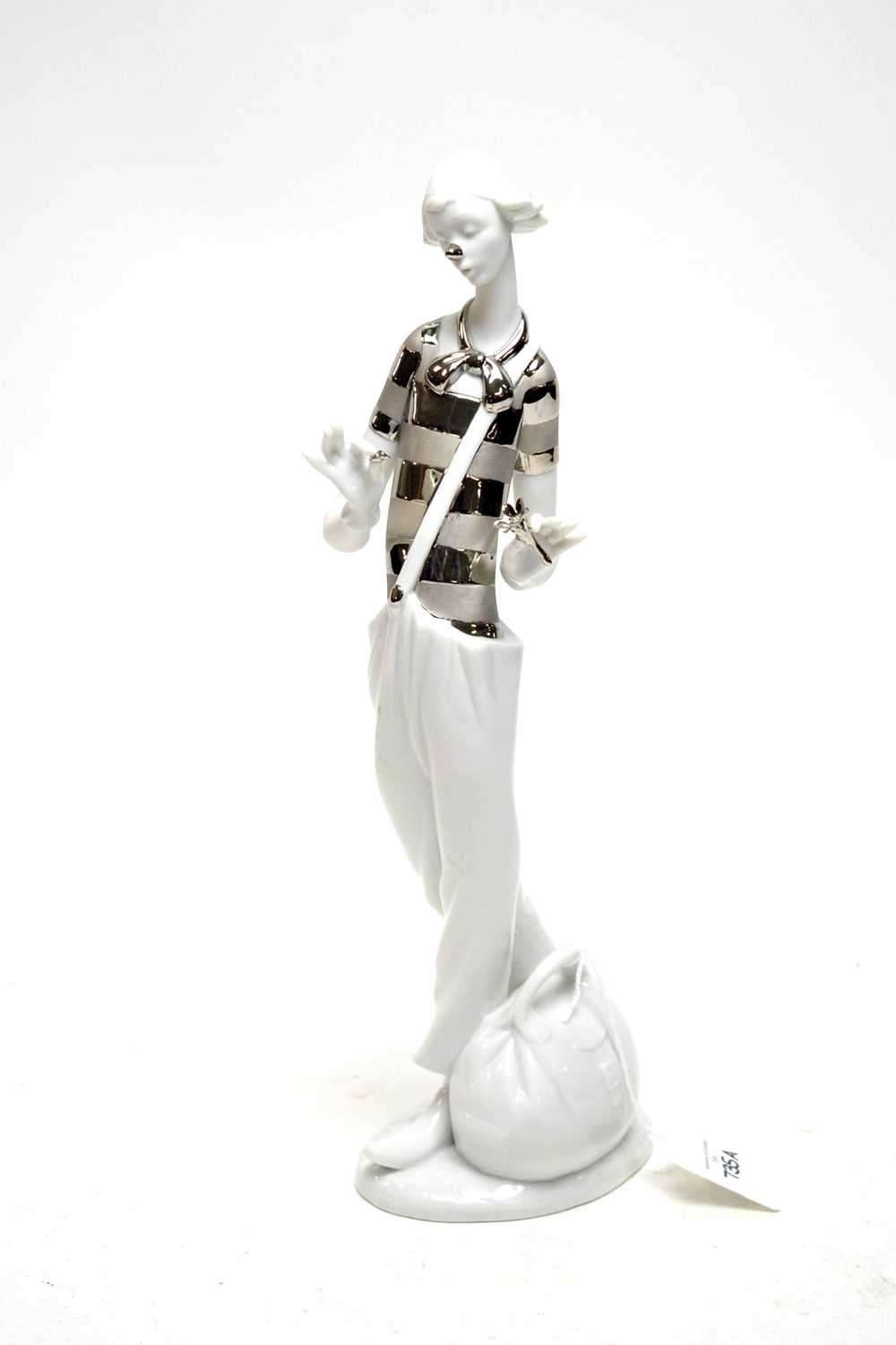 Lot 735 - A Lladro porcelain figure.
